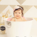 gold and white baby photo shoot