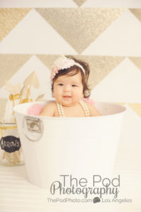 gold and white baby photo shoot