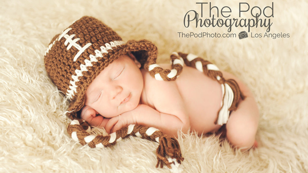 Newborn Baby Boy in Football Costume Stock Photo by ©katrinaelena