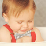 Best-Baby-Photographer-Westwood-Studio-Portrait-Session-First-Birthday-Cake-Smash-Looking-Down-Bowtie