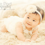 Cute-Baby-Girl-Romper-Headband-Pearls-Tummytime-Six-Months-Baby-Photographer-Brentwood-Studio