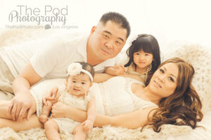 Family-Snuggled-Laying-On-Bed-Girls-Dressed-Up-Candid-Photography-Marina-Del-Rey