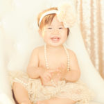 One-Year-Old-Portrait-Photographer-Marina-Del-Rey-Studio-Pod-Glow-Classic-Chair-Tutu-Lace-Headband-Pearls-Sparkle-Sequins