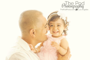 Best-Family-Portrait-Photographer-Daddy-Daughter-Kisses-Nuzzle-Sweet-Smiles-Laughing-Baby-Girl-White-Window-Glow-Manhattan-Beach