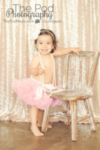 Best-First-Birthday-Cake-Smash-Photographer-Los-Angeles-Portrait-Studio-Pink-Tutu-Sparkle-Sequins-Pearls-Headband-Standing-One-Year