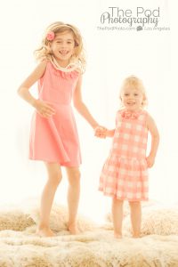 children jumping on bed