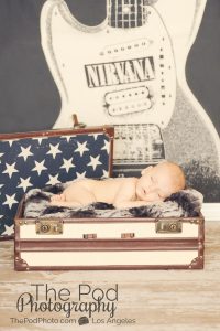rocker baby nirvana poster newborn sleeping in sutcase