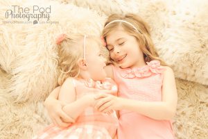 two sisters candid looking at each other