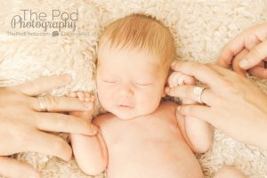 baby holding parents fingers newborn baby