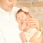 dad-holding-newborn-baby-daughter