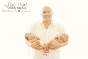 dad-holding-twin-babies