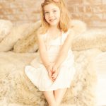 girl-in-cream-dress-and-peach-headband-beverly-hills-childrens-photography-studio