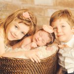 two-siblings-with-infant-photo
