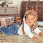 baby-with-trunk-props-traveler-theme-photos