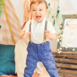12-month-milestones-baby-standing-up-alone-cute-boho-photography-set