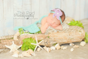 baby-laying-on-beach-st-in-mermaid-costume
