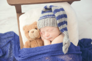 cute-baby-cuddling-bear-professional-photo-studio