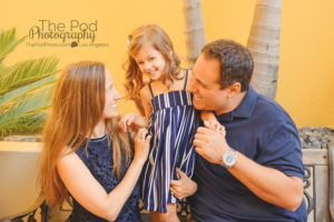 parents-tickling-daugher