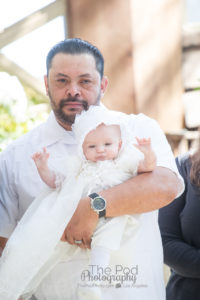 Daddy daughter photo taken during baptism ceremony