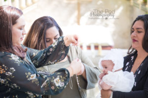 Godparents give baptism gift to niece