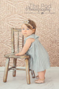 baby-standing-holding-onto-chair