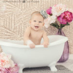 naked-baby-in-bathtub-with-flowers