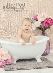 naked-baby-in-bathtub-with-flowers