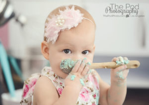 baby-eating-cake-off-of-baking-spoon