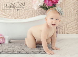 naked-baby-crawling-by-bathtub