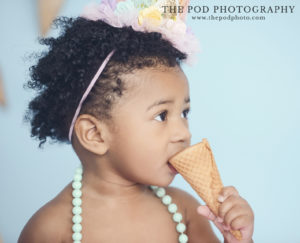Baby girl eating ice cream cone