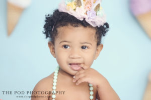 eating first birthday cake