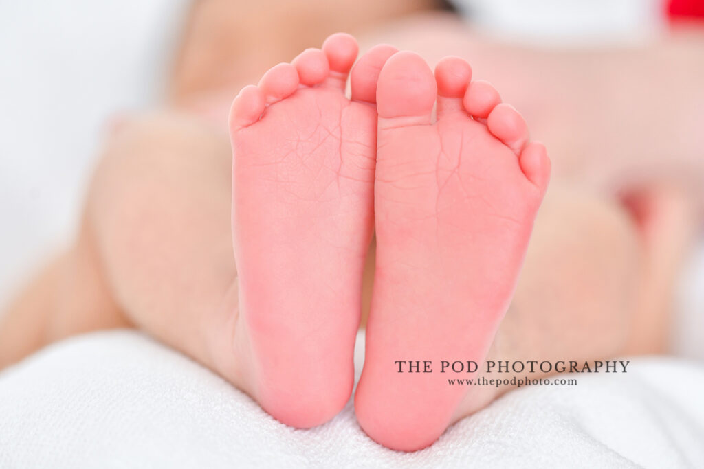 Newborn baby boys tiny feet