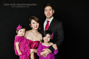 mother-father-daughters-family-photo