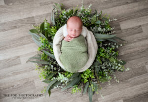 newborn-photoshoot-baby-in-eucalyptus-wreath