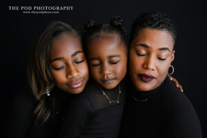 mother-daughter-portrait-black-background
