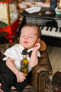 newborn-photoshoot-man-cave-theme-piano-and-popcorn-los-angeles