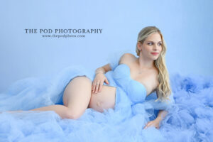 blue-maternity-gown-soft-reclining-portrait
