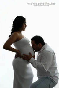 backlit-belly-kiss-maternity-portrait-the-pod-photography