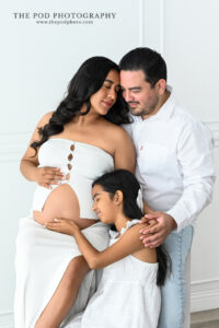 family-maternity-portrait-cuddling-the-pod-photography